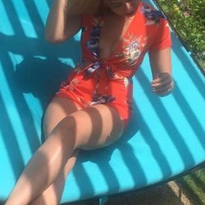 Orange floral tie front romper